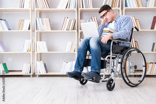 Disabled student studying in the library