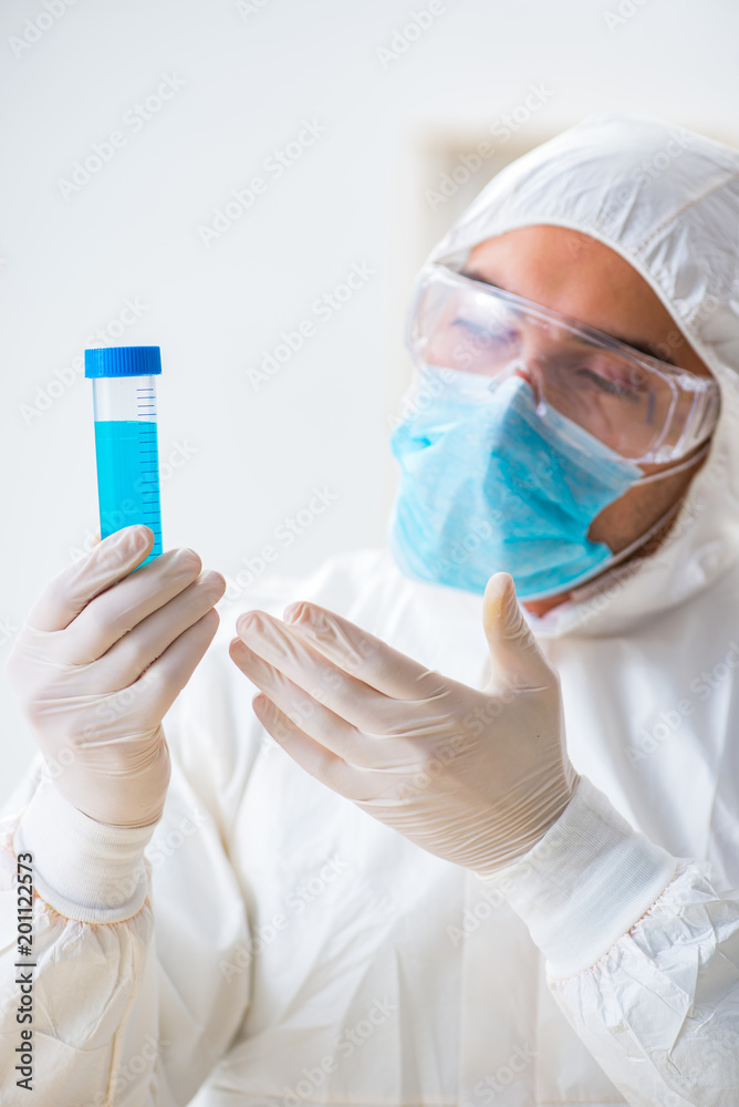 Young chemist student working in lab on chemicals Young chemist student working in lab on chemicals