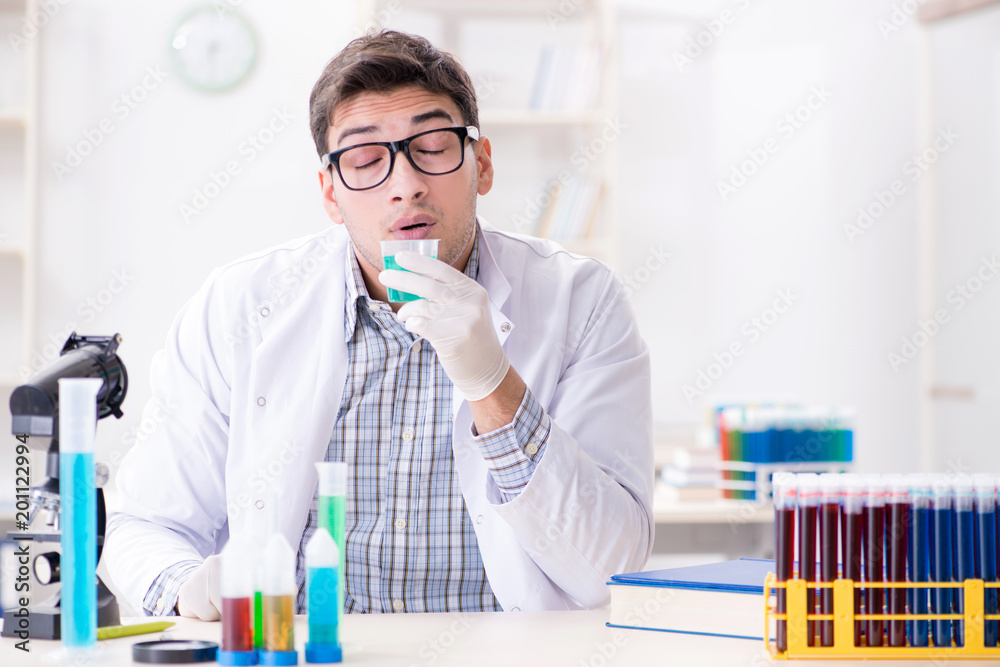 Chemistry student doing chemical experiments at classroom activi Chemistry student doing chemical experiments at classroom activi