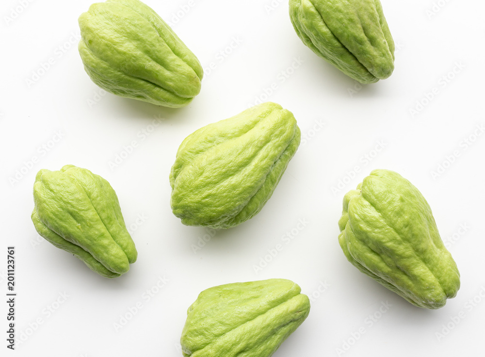 Directly above view of chayote or choko arranged on a white table Directly above view of chayote or choko arranged on a white table