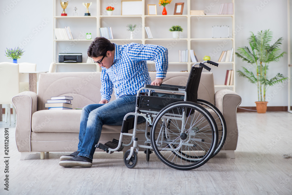 Young student on wheelchair in disability concept Young student on wheelchair in disability concept