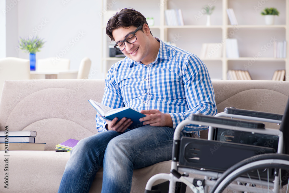 Young student on wheelchair in disability concept Young student on wheelchair in disability concept