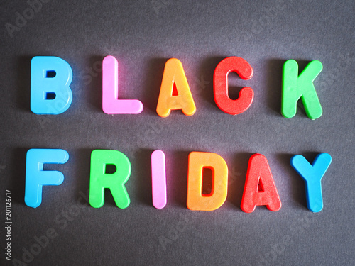 colorful lettering of black friday on a black background.