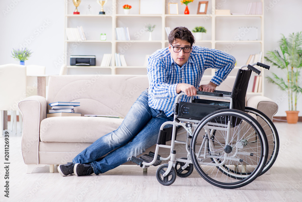 Young student on wheelchair in disability concept Young student on wheelchair in disability concept
