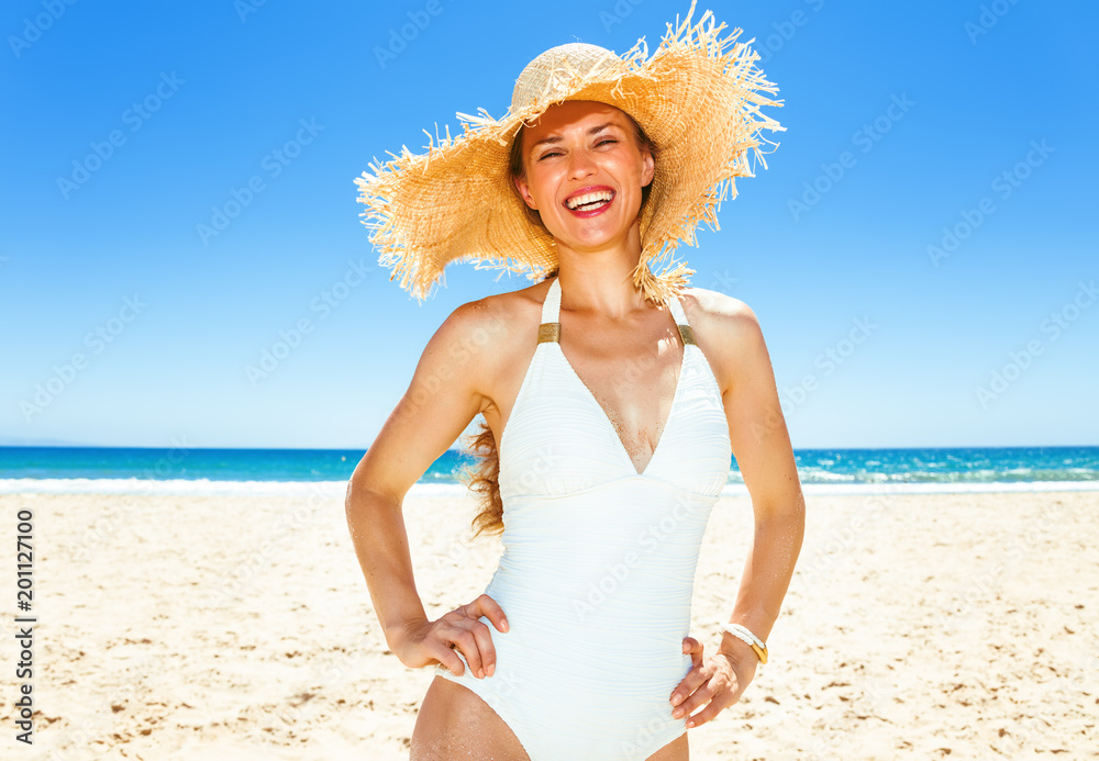 Portrait of happy modern woman in swimsuit on seashore Portrait of happy modern woman in swimsuit on seashore