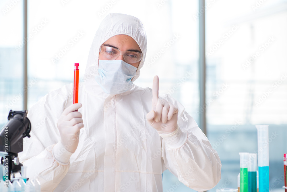 Man doctor checking blood samples in lab Man doctor checking blood samples in lab