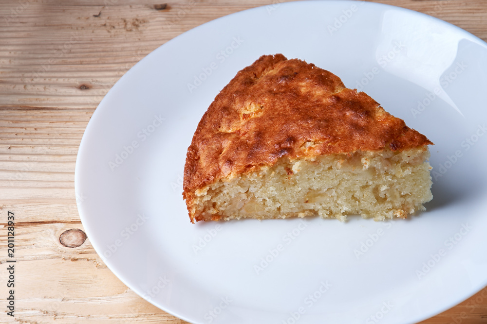 tasty apple pie slice on white plate