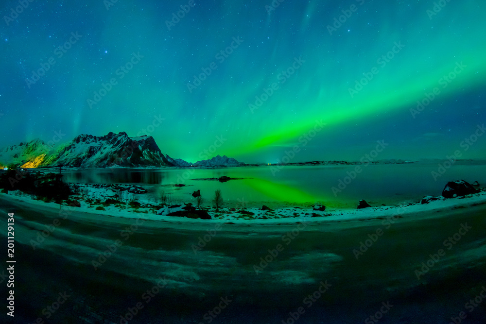 View of Lofoten Islands during winter time is a dream for all landscape photographers. At this time of the year, the colourful and enchanting Aurora Borealis light up the clear night skies