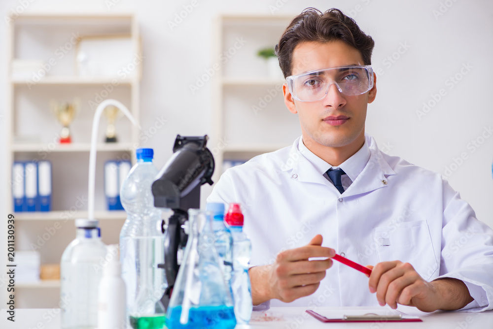 Lab assistant testing water quality Lab assistant testing water quality