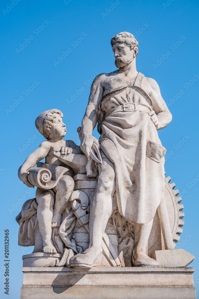 Sculpture of mechanic and his scholar on Zoll Bridge in Magdeburg downtown, Germany