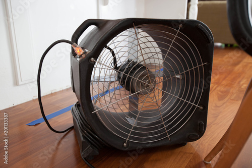 Industrial Fan For Water Damage In Kitchen