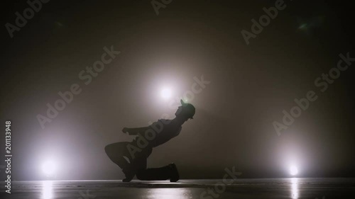 Young street dancer boy dancing on a talent show competition stage to become popular