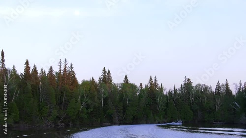 fisherman ahead taking corner on lake 4k photo