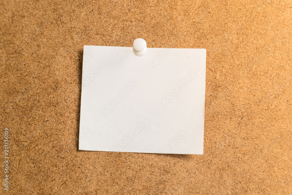 white sticker for notes on a cardboard background white sticker for notes on a cardboard background