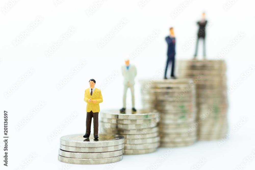Miniature people : Businessman standing on stack of coin. Image use for financial, business vision concept. Miniature people : Businessman standing on stack of coin. Image use for financial, business vision concept.