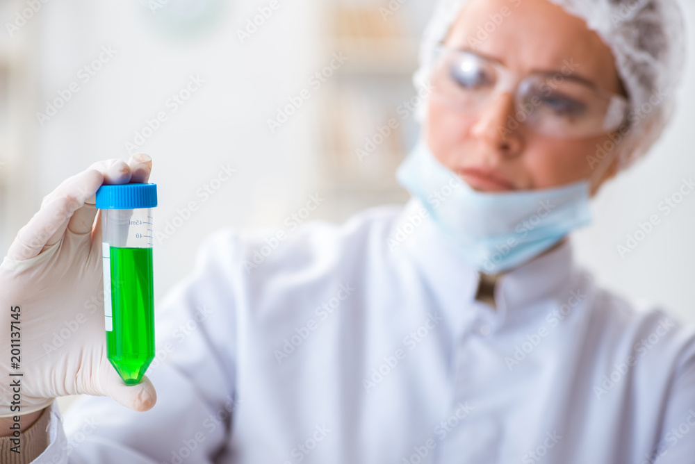 Woman chemist working in hospital clinic lab Woman chemist working in hospital clinic lab