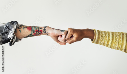 People bumping their fists together photo