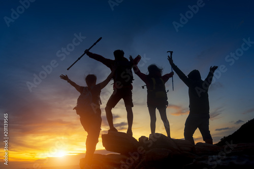 Silhouette of a group people to the mountain