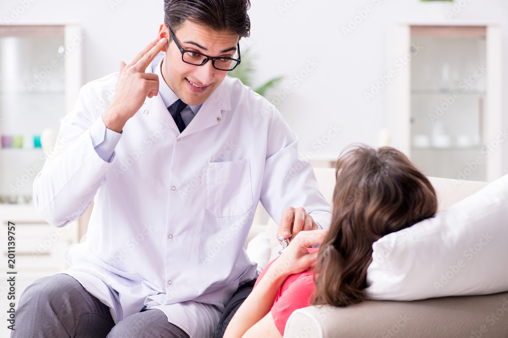 Pregnant woman patient visiting doctor for regular check-up