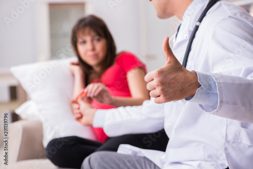 Pregnant woman patient visiting doctor for regular check-up