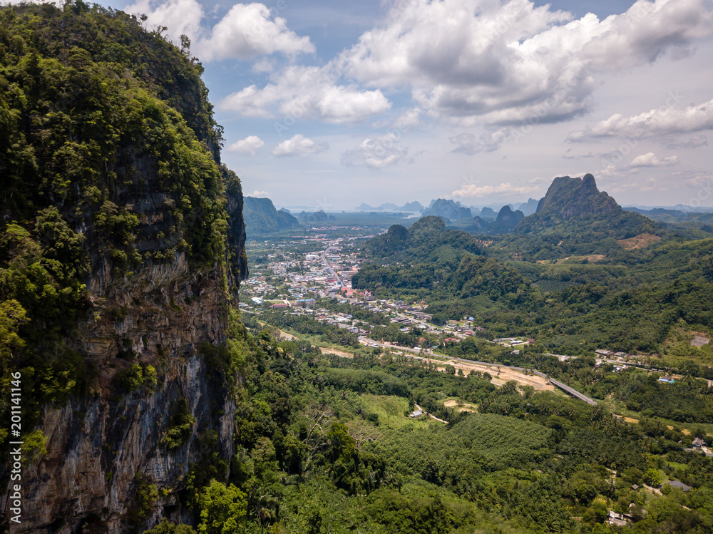 Aerial view of the small Thai town of Phang Nga surrounded by jungle and mountains