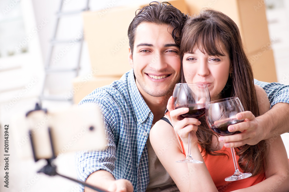 Couple taking selfie and drinking wine