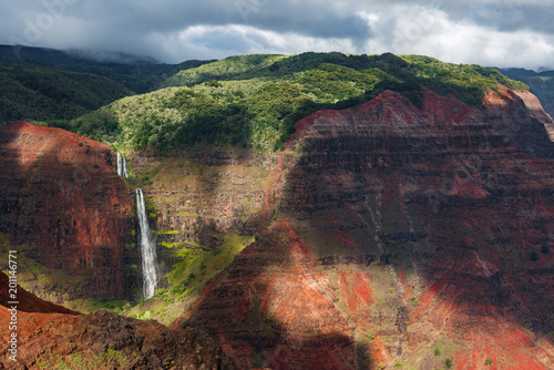 impressive waterfalls after heavy rainfall in waimea canyon kauai hawaii