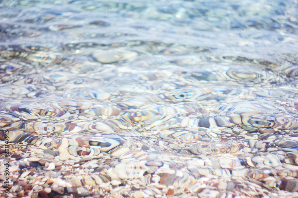 The bottom of the sea with clear water, the pebble stones background The bottom of the sea with clear water, the pebble stones background