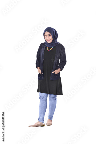 Beautiful asian muslim woman standing with hand on pocket