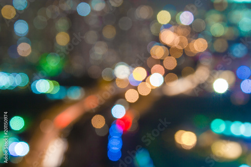 Blurred bokeh night life cityscape for club venue and urban city life. Night time out on the town for big party with friends and entertainment. Happiness and fun times.