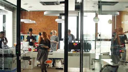 Portrait of happy young business team in modern office. Work in loft interior.