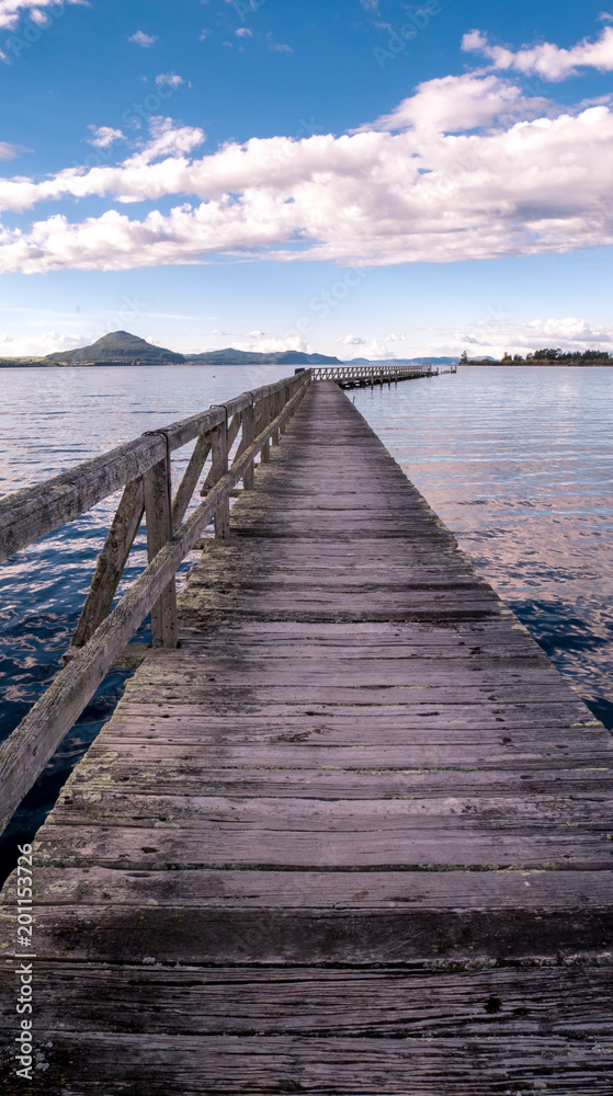 Fototapeta premium Sunset on Tokaanu Wharf, lake Taupo, North Island, New Zealand 