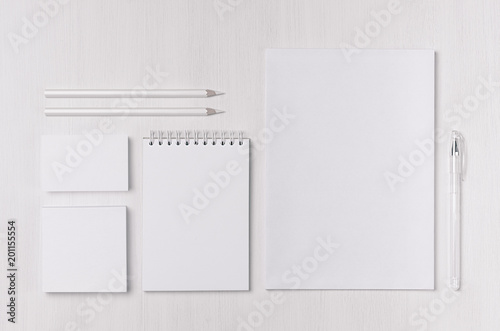Corporate identity set of blank white stationery on soft white wood board. Template for branding, business presentations and portfolios. © finepoints