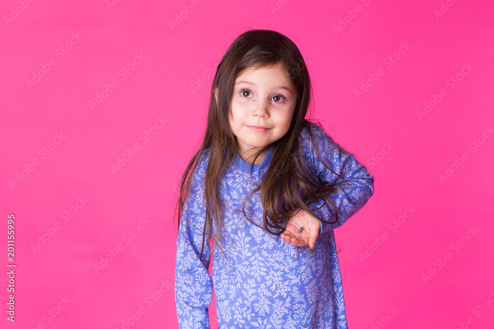 Portrait of adorable little girl isolated on a pink background Portrait of adorable little girl isolated on a pink background