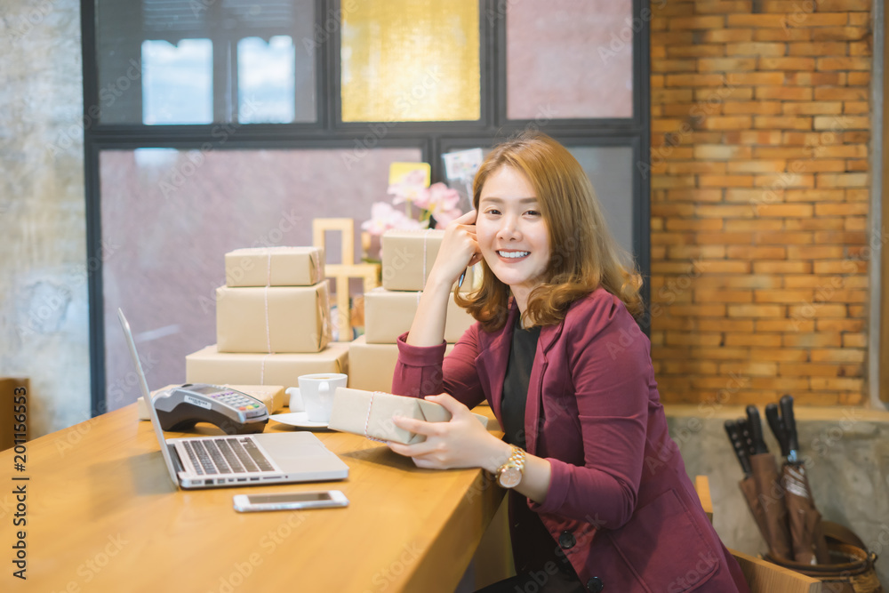 Young asian teenager owner business woman work at home for online shopping reading and writing the order with digital tablet, preparing package the product, entrepreneur alpha generation life style Young asian teenager owner business woman work at home for online shopping reading and writing the order with digital tablet, preparing package the product, entrepreneur alpha generation life style