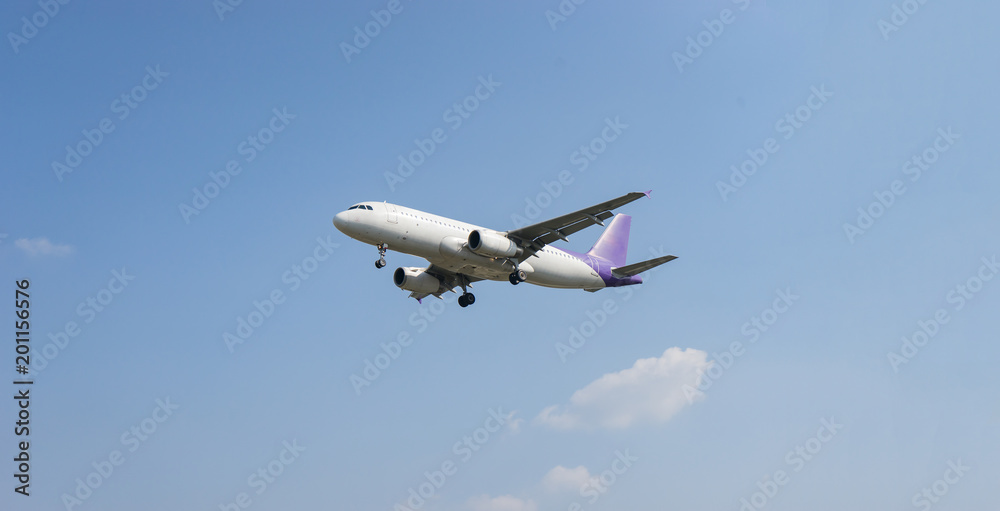 Passenger airplane concept,white airplane is flying in the blue sky with clouds over mountains, sea at colorful. Passengers aircraft is landing,Private jet plane. Travel Passenger airplane concept,white airplane is flying in the blue sky with clouds over mountains, sea at colorful. Passengers aircraft is landing,Private jet plane. Travel