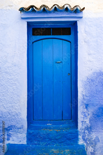 Traditional and Beautiful Blue Door,Old Medina, Chefchaouen, Blue City of northwest Morocco © Roserunn