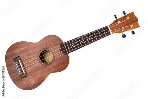 The brown ukulele on the white background photo