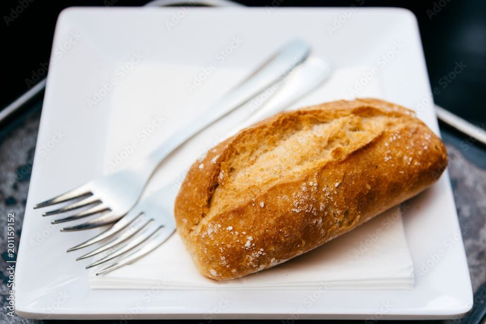 Close up of bread and forks Close up of bread and forks