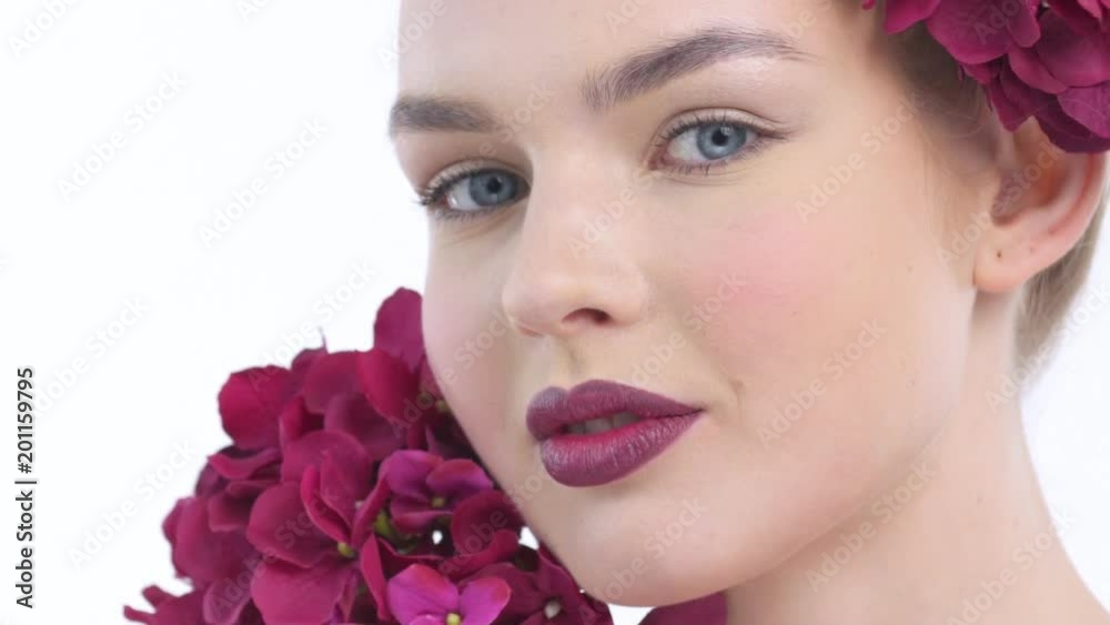 Closeup Beautiful  face of an young woman with flowers