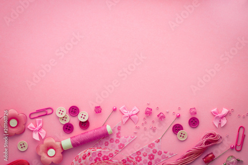  Sewing tool or craft tool on a pink background , top view or overhead shot with copy space