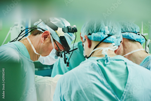 cardio surgery operating room. male cardiac surgeon in hospital photo