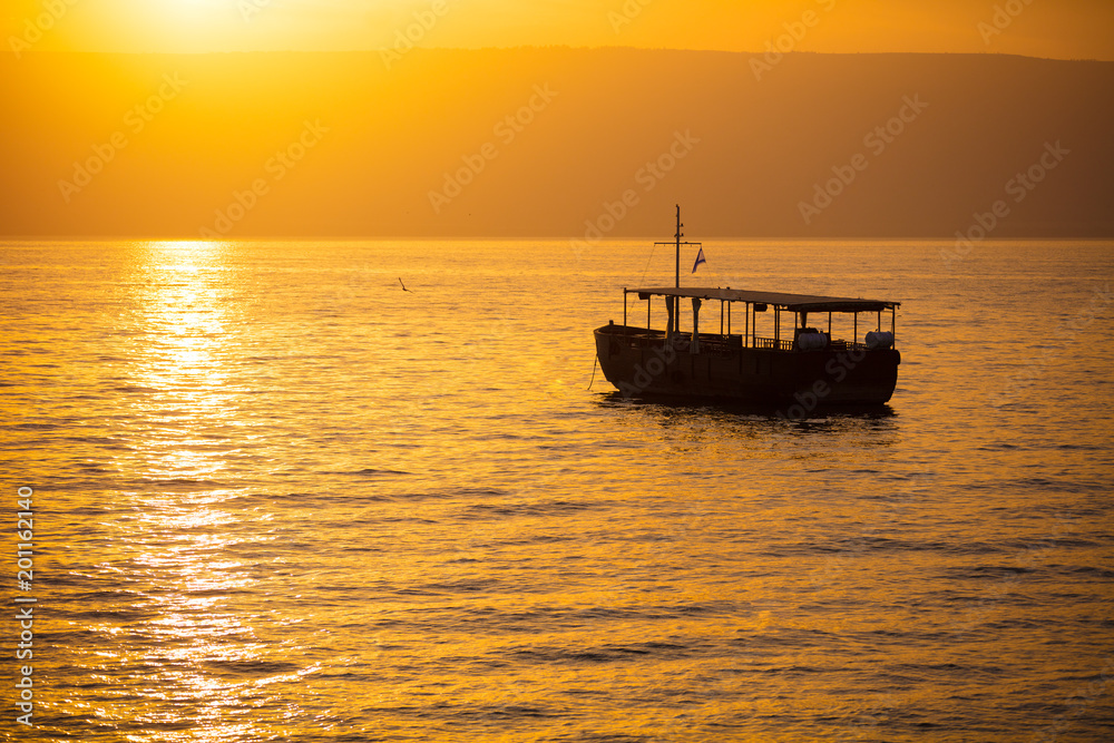 Beautiful Sea of Galilee in the morning. Golden sunrise over Kinneret Beautiful Sea of Galilee in the morning. Golden sunrise over Kinneret
