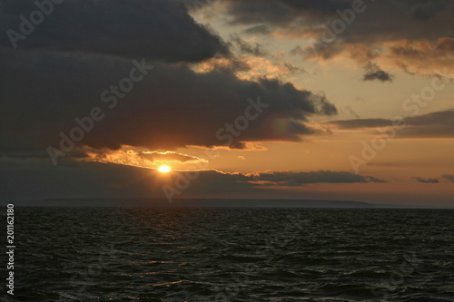 Crimson sunset on the river. © AKlion