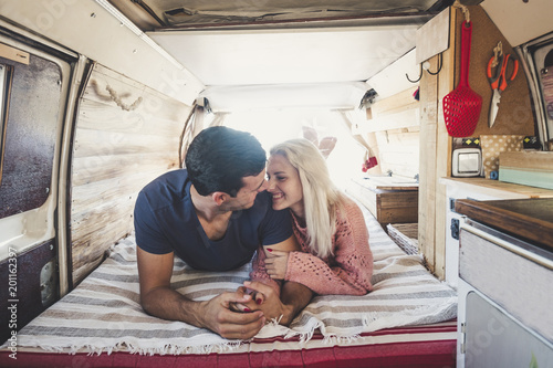 lover couple caucasian nbeautiful inside an old restored van photo