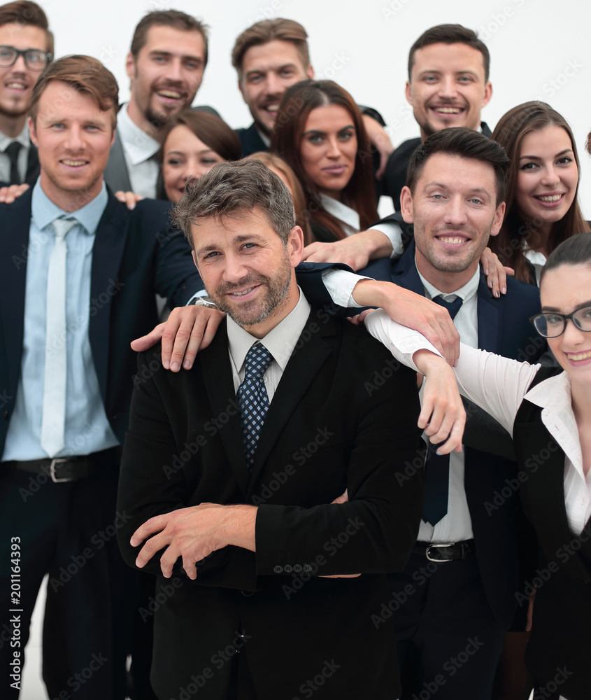 confident businessman standing on background of her business team. confident businessman standing on background of her business team.
