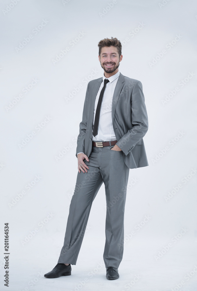 Half length portrait of a businessman with hands in his pockets
