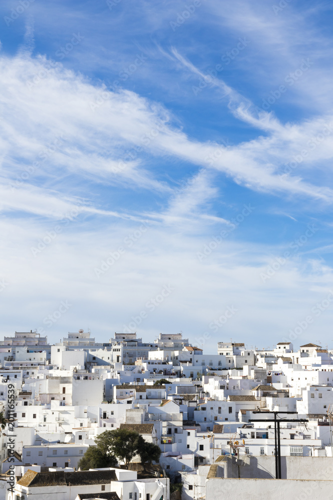 Vejer de la Frontera, Spain. A Spanish hilltop Pueblo Blanco (White Town) in the province of Cadiz, Andalusia. Horizontal panoramic view and urban landscape