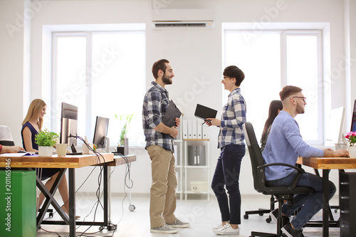 Young people working in off...