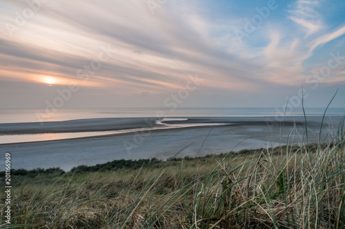 The beach at the Maasvlakte near Rotterdam in the Netherlands during sunset.